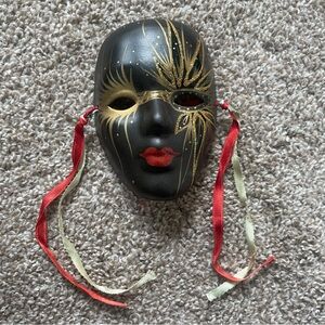 Black and Gold Decorative Mask with Red Accents
